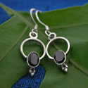 Sterling silver dangleswith a cabochon stone of rainbow moonstone.
