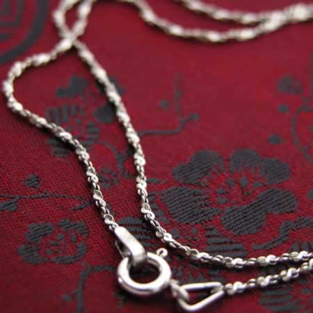 Flattened oxidized silver chain.