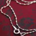 Flattened oxidized silver chain.