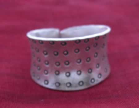 Hammered band with carved dots.